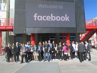 Facebook Tour -  Students in front of Facebooks giant movie screen